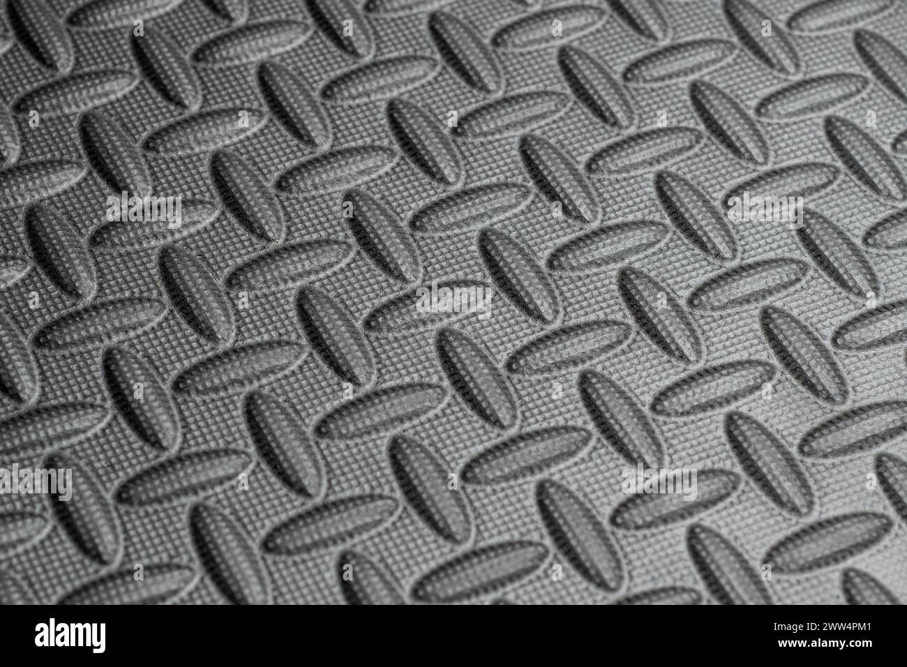 Graue, strukturierte Puzzle-Bodenmatte aus eva-Schaum Stockfoto