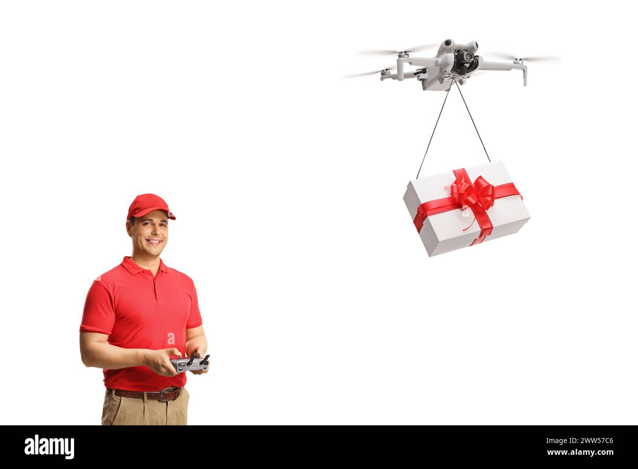 Drohnenfahrer liefert eine vorhandene Box isoliert auf weißem Hintergrund Stockfoto