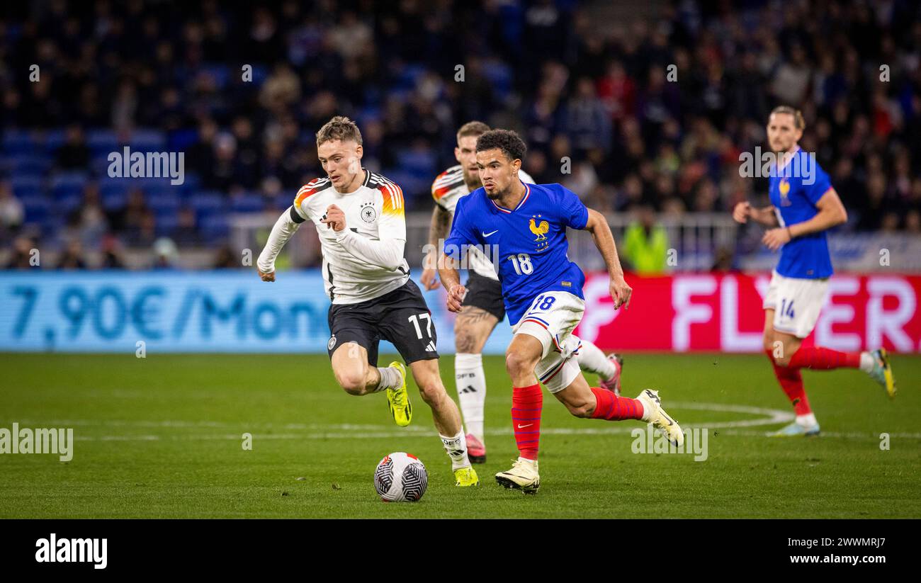 Lyon, Frankreich. März 2024. Warren Zaire-Emery (FRA), Florian Wirtz (Deutschland) Frankreich - Deutschland Frankreich - Deutschland 23.03.2024 Copyright ( Stockfoto