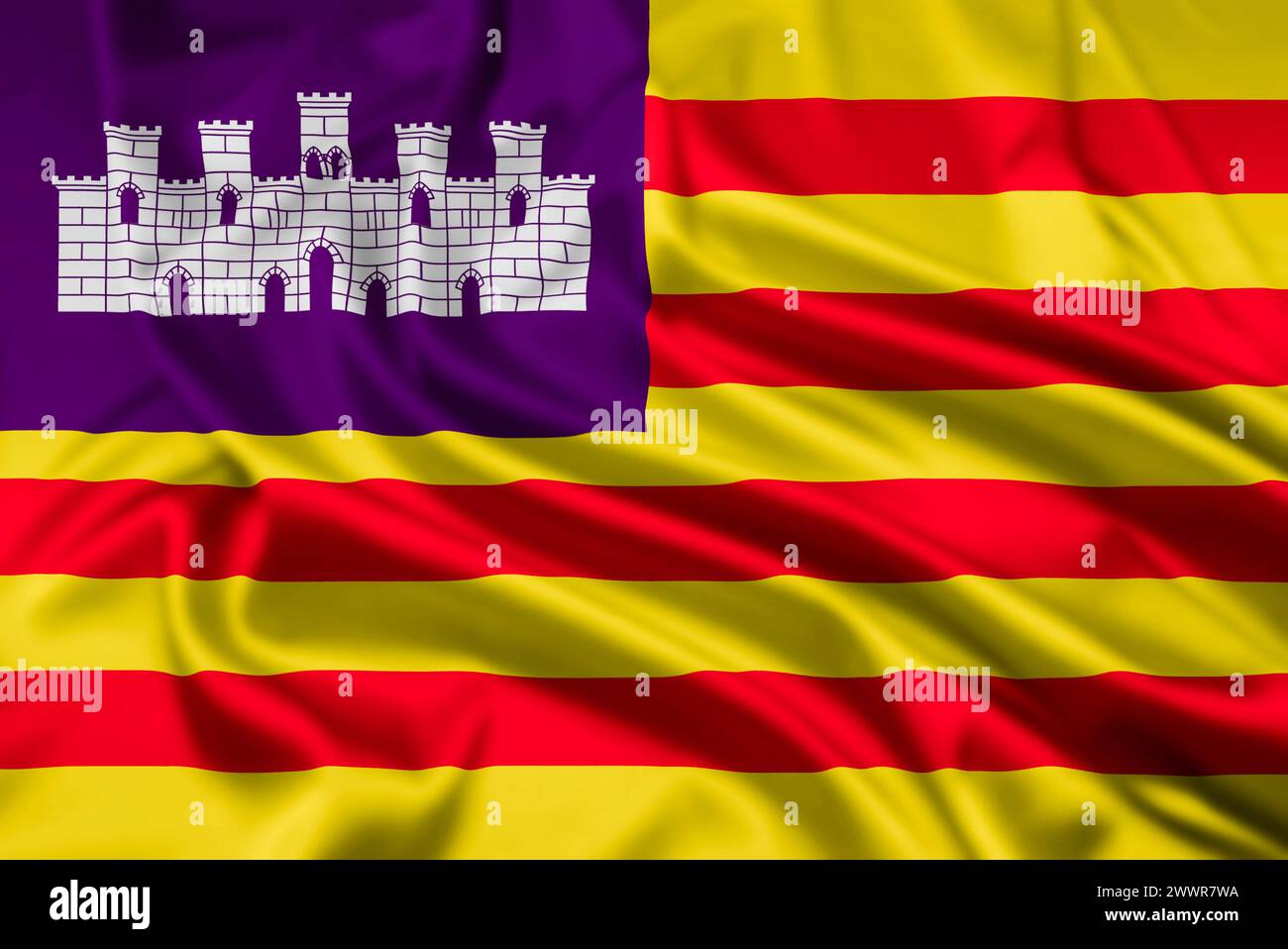 Die Flagge der Balearen, eine der autonomen Gemeinschaften Spaniens, mit einem Welleffekt Stockfoto