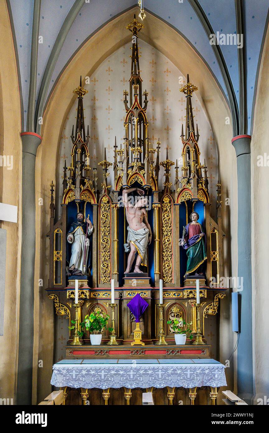 Seitenaltar mit der Figur des hl. Sebastian, Pfarrkirche St. Georg und Mauritius, Wildpoldsried, Allgaeu, Schwaben, Bayern, Deutschland Stockfoto