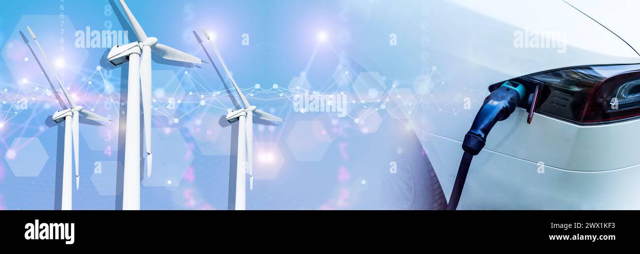 Laden eines Elektroautos am Bahnhof. Erneuerbare Energien, Windmühlenkonzept. Grüne Energie und Technologien für nachhaltige Entwicklung. Hochwertige Fotos Stockfoto