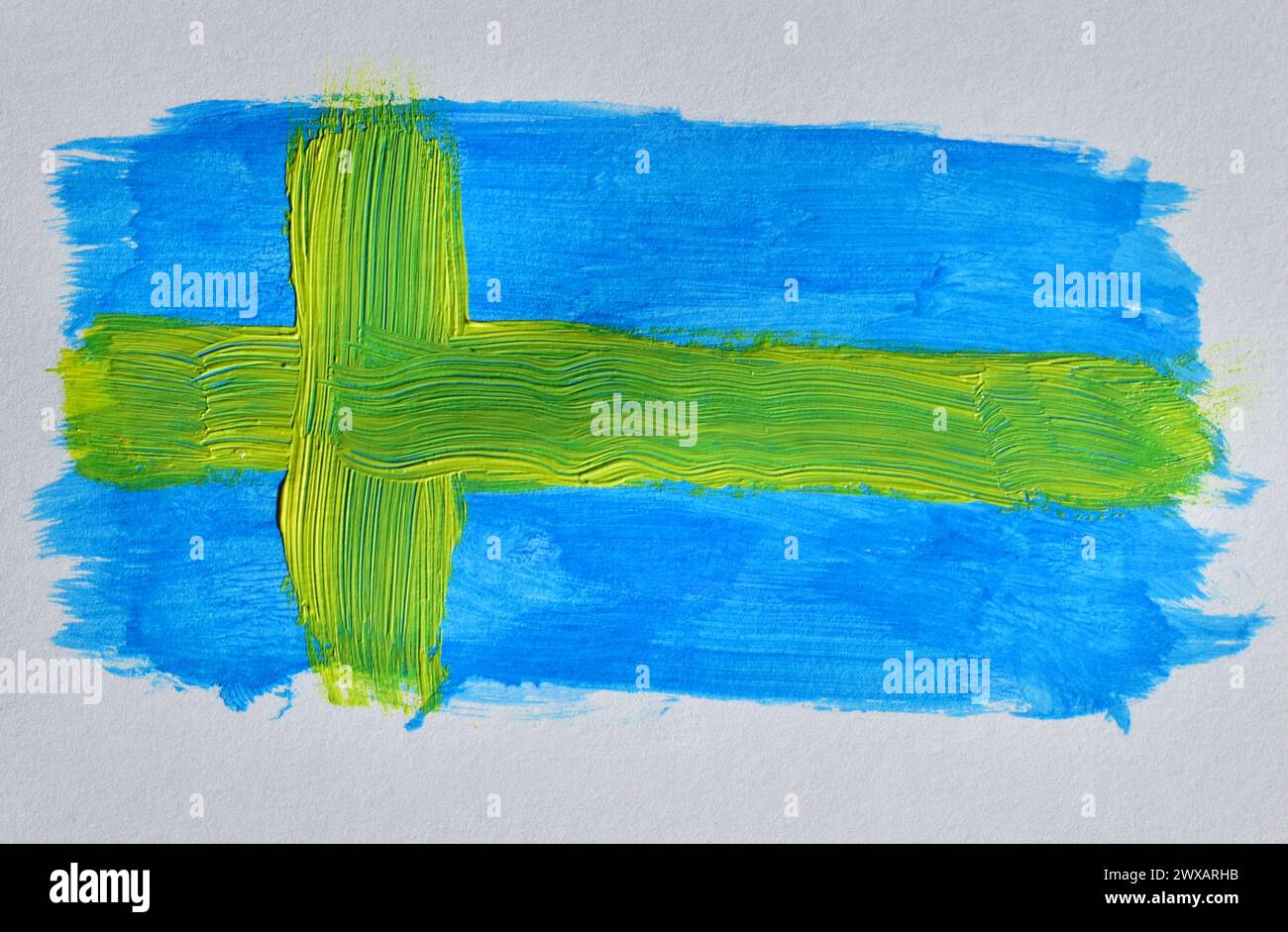 Auf einem weißen Blatt wurde eine Zeichnung mit Aquarellen gezeichnet, die wie die Flagge Schwedens aussehen. Stockfoto
