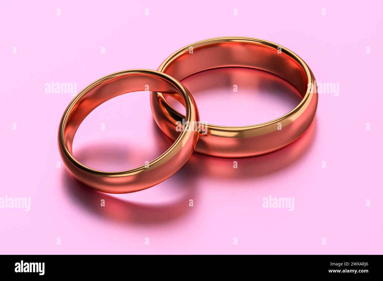 Zwei goldene Hochzeitsringe für Paare. Konzepte für Einheit, Liebe und Romantik Stockfoto