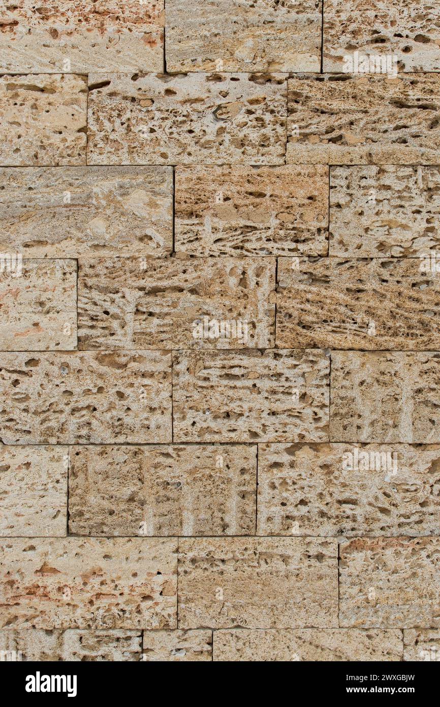 Muster Ziegelblöcke Schale Sand Stein Wand Textur Hintergrund abstrakte Struktur. Stockfoto