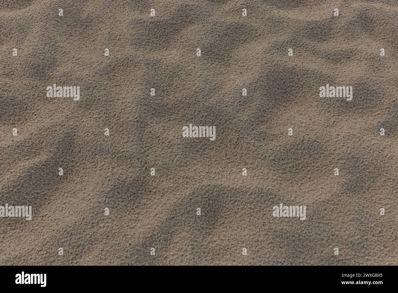 Strand Sand abstrakte Muster Fußabdrücke nach Regen Natur Textur Hintergrund Wüste Hintergrund Oberfläche. Stockfoto