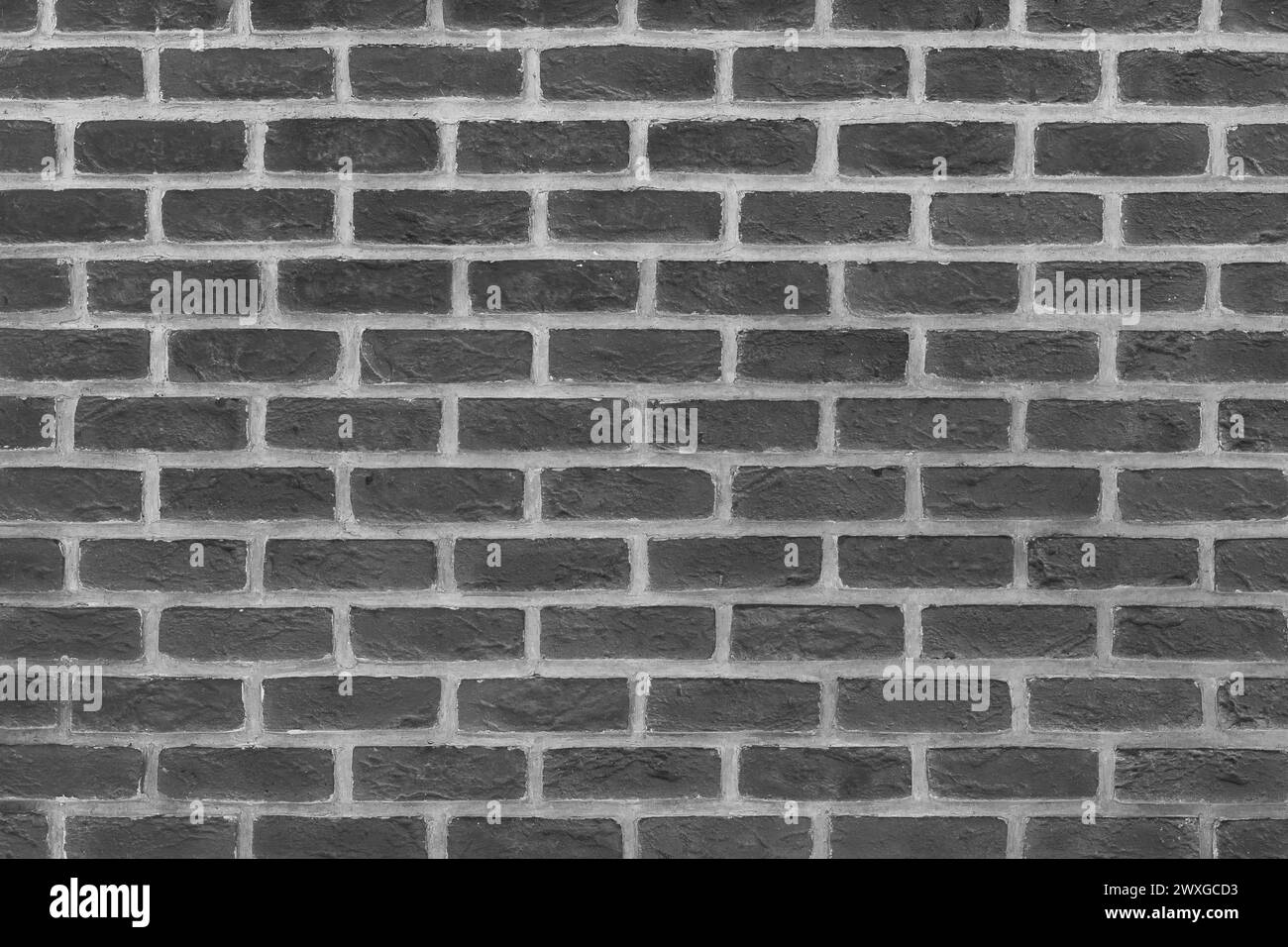 Dunkelgraue Ziegelwand Backstein Textur Hintergrund Architekturfassade. Stockfoto