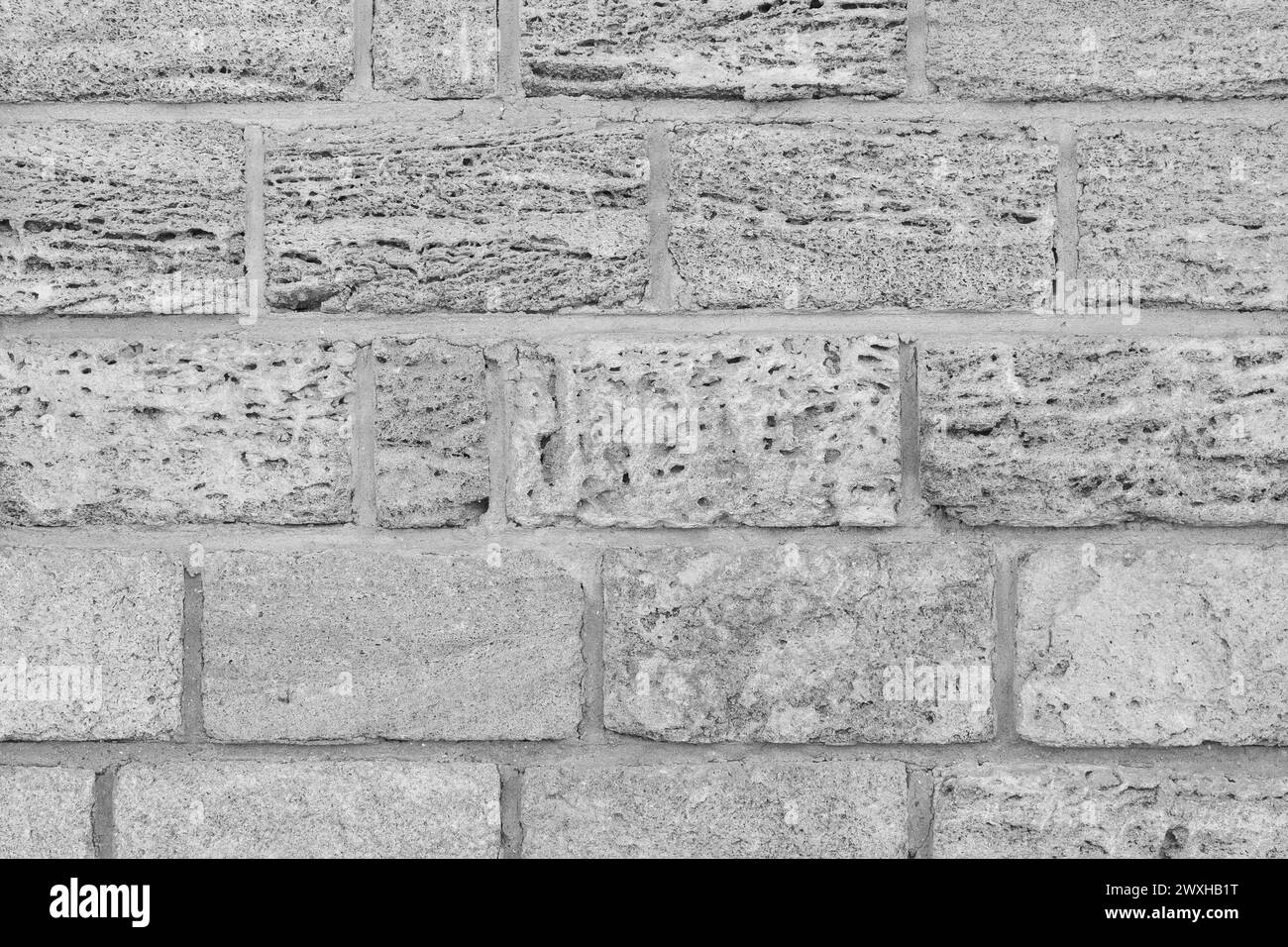 Helles Natürliches Grau Schale Ziegelstein Wand Textur Sand Struktur Hintergrund Kalkstein. Stockfoto