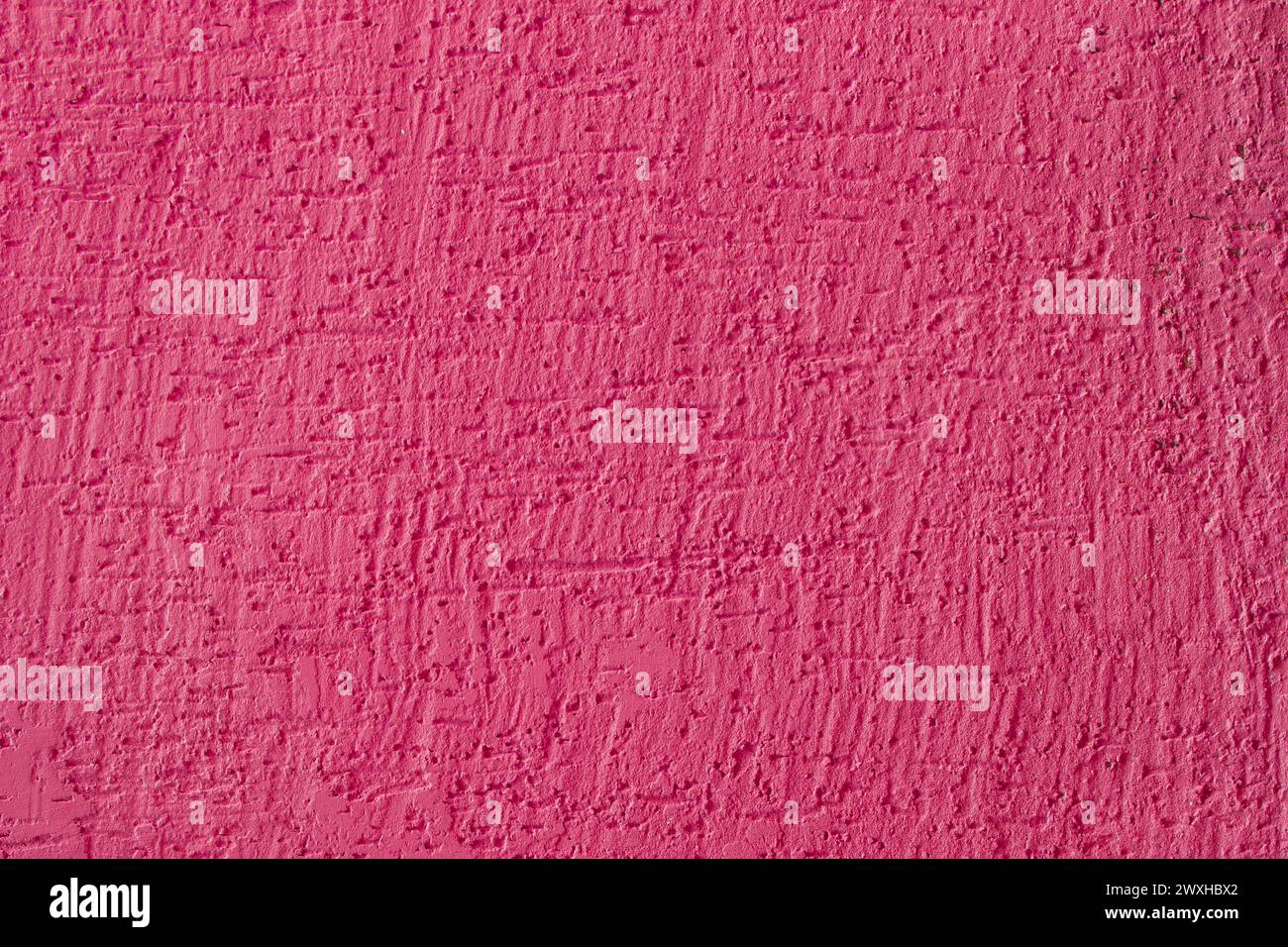 Rosa Farbe Betonwand Oberfläche Putz Textur Stuck Hintergrund abstrakte purpurrote Farbe Zement Struktur Hintergrund. Stockfoto