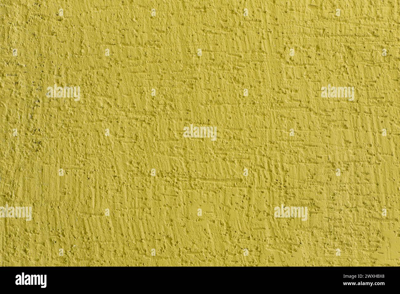 Helles gelbes lebhaftes Anstrich Oberfläche Putz Wand Textur Stuckhintergrund abstraktes Muster Hintergrund. Stockfoto