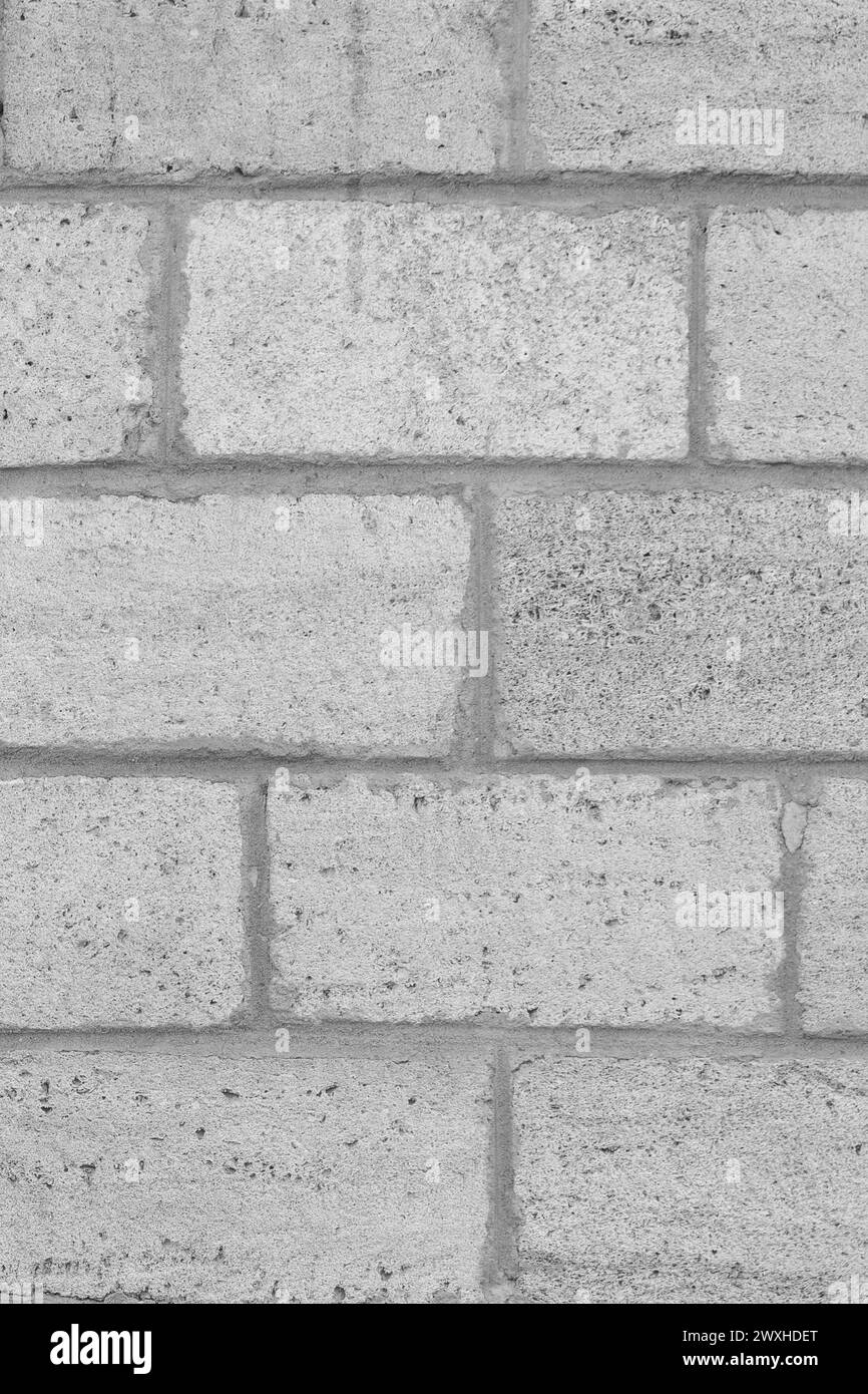 Helles Natürliches Grau Schale Ziegelstein Wand Textur Sand Struktur Hintergrund Kalkstein Vertikal. Stockfoto