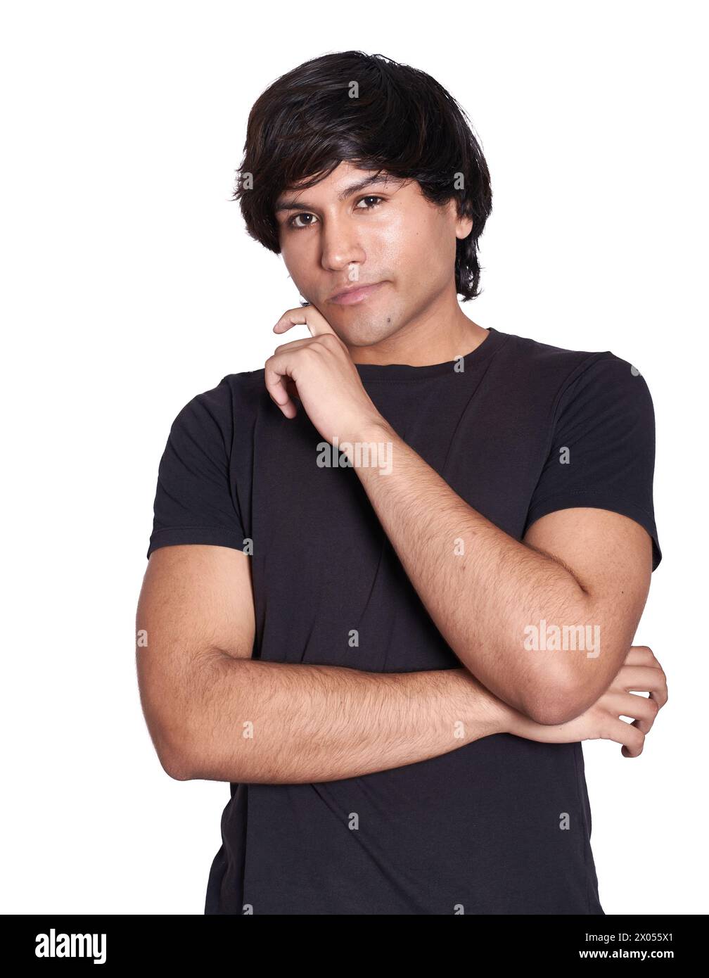 Mittlere Aufnahme eines jungen Mannes, der für die Kamera posiert, eine seiner Hände ist auf seiner Wange. Weißer Hintergrund. Stockfoto Mittlere Aufnahme eines jungen Mannes, der für die Kamera posiert, eine seiner Hände ist auf seiner Wange. Weißer Hintergrund. Stockfoto