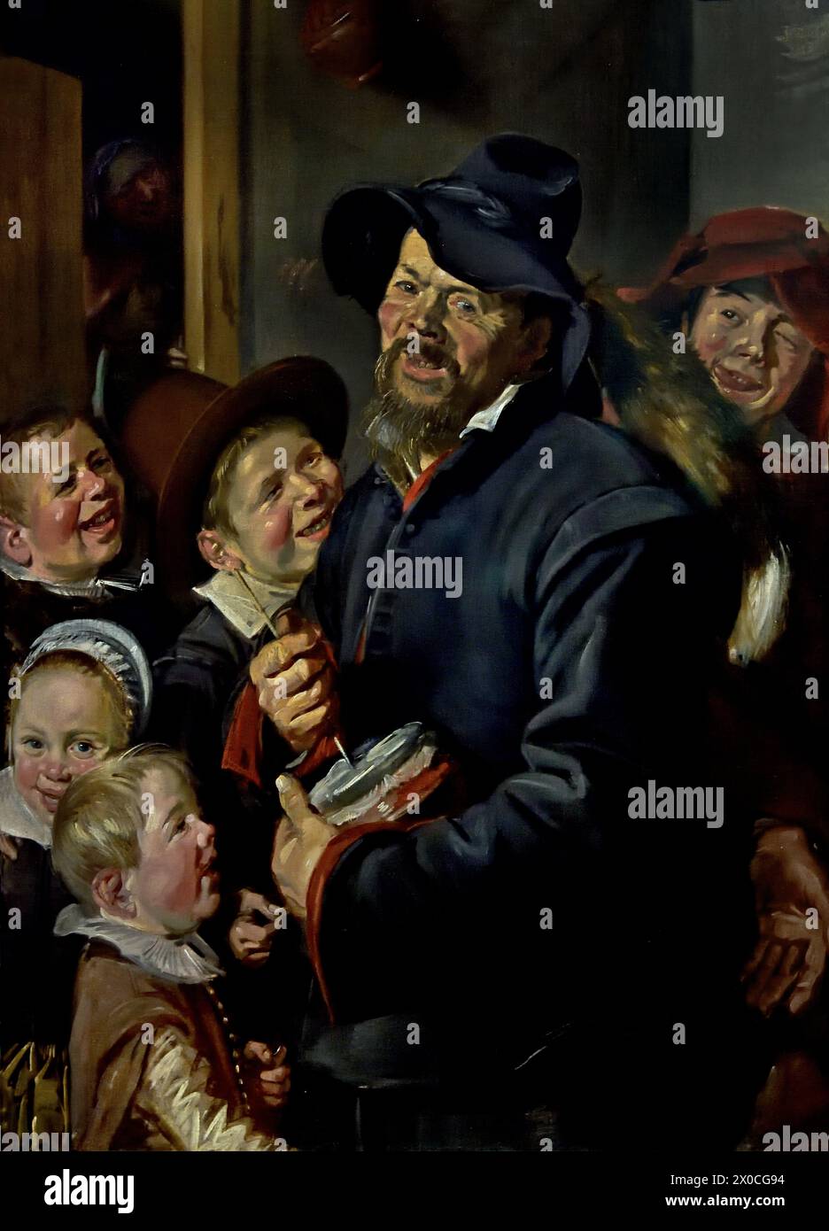 The Rommelpot Player 1620 ( Musikinstrument zum Sammeln von Geld oder Lebensmitteln ) Frans Hals, 1582-1666, Antwerpen-Haarlem, Niederländisch, Niederlande, 17. Jahrhundert, niederländisches Goldenes Zeitalter ( Er malte lebendige, manchmal sogar fröhliche Porträts von Menschen aller Ebenen der Gesellschaft, wichtigen Menschen, frechen Kindern und sogar Betrunkenen oder Menschen, die für verrückt erklärt wurden. ) Stockfoto