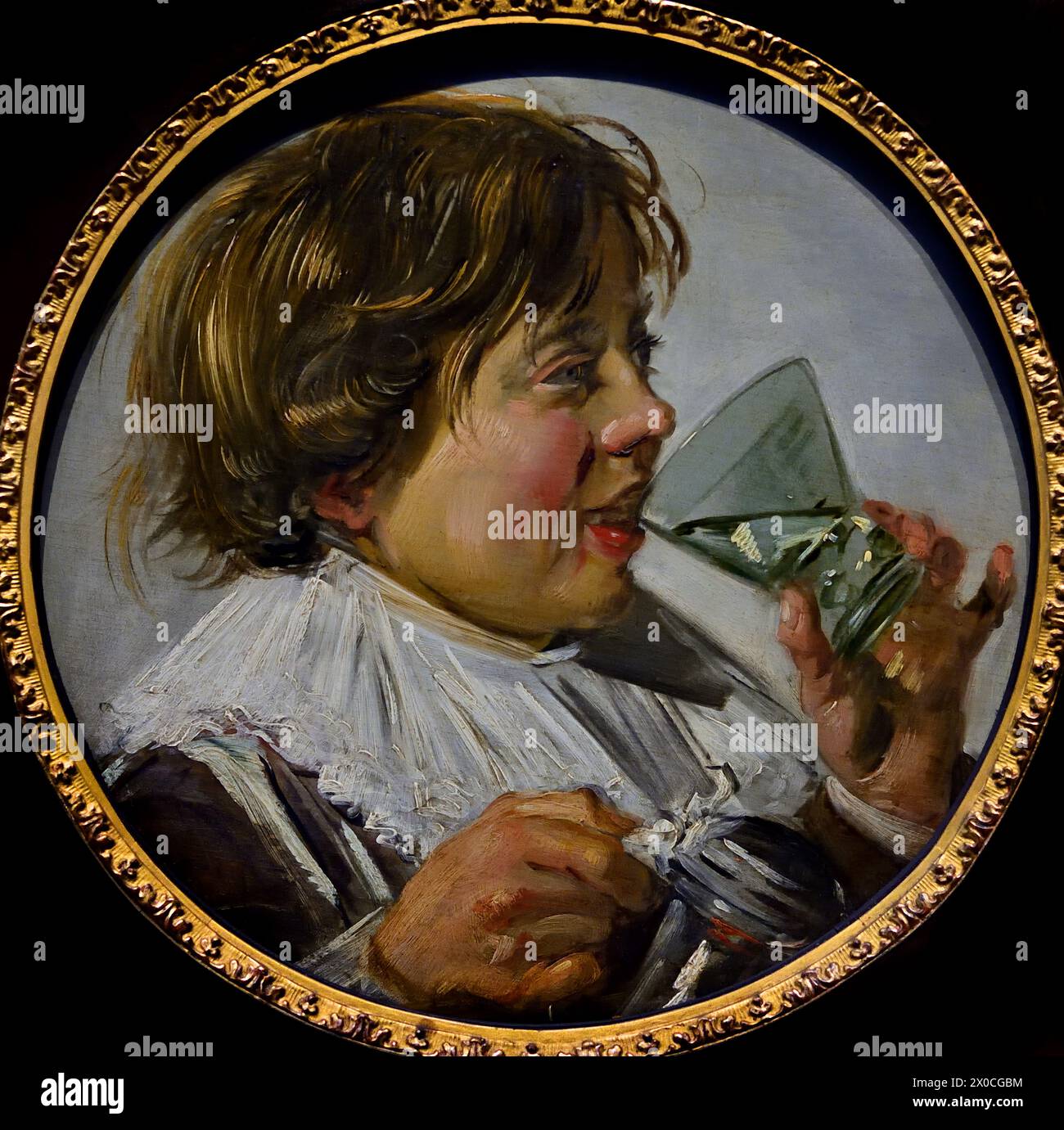 Lachender Junge mit Glas 1630 von Frans Hals, 1582-1666, Antwerpen-Haarlem, Niederländisch, Niederlande, 17. Jahrhundert, niederländisches Goldenes Zeitalter ( Er malte lebendige, manchmal sogar fröhliche Porträts von Menschen aller Ebenen der Gesellschaft, wichtigen Menschen, frechen Kindern und sogar Betrunkenen oder Menschen, die für verrückt erklärt wurden. ) Stockfoto