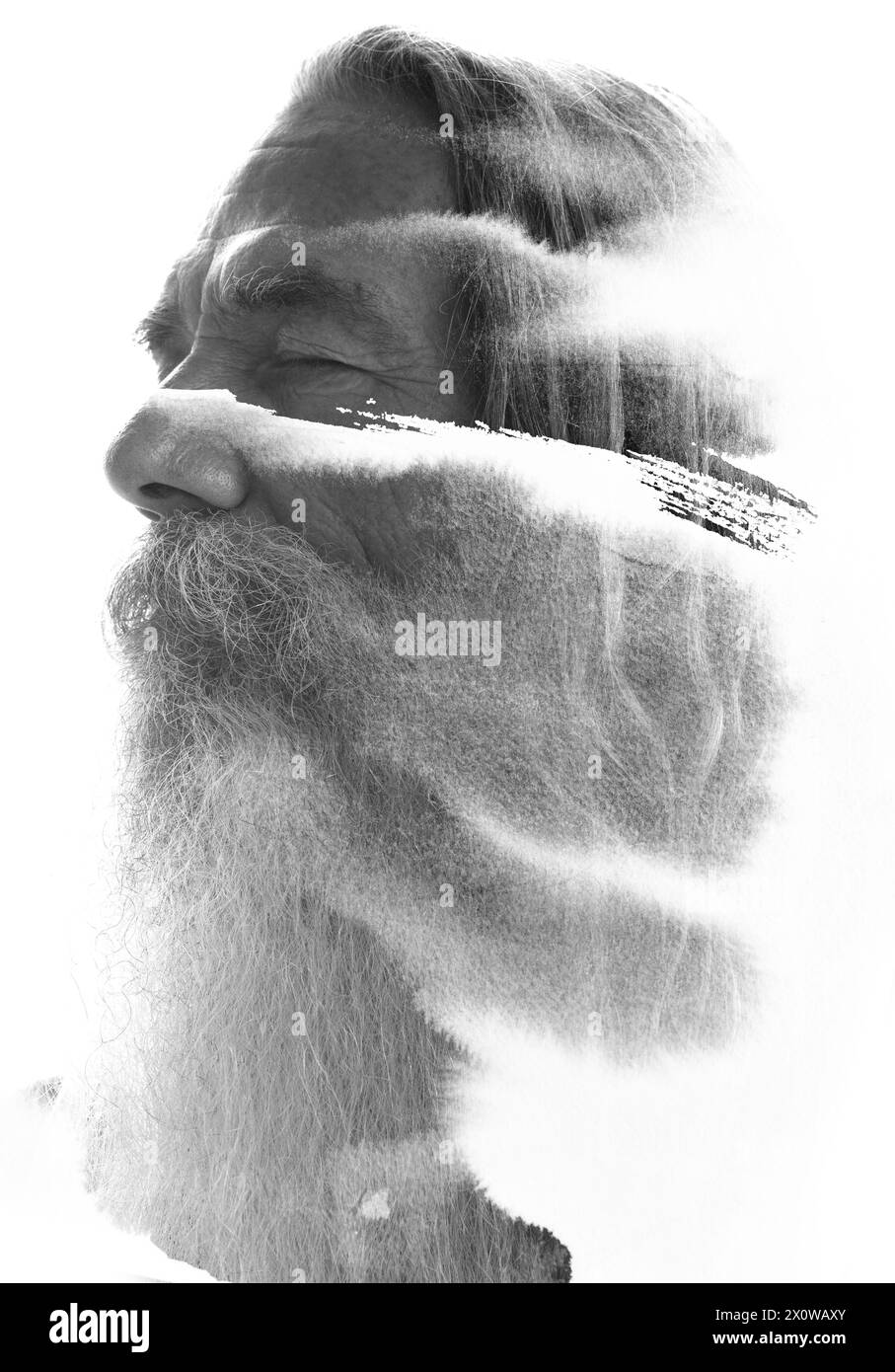 Ein Halbprofil-Bildporträt eines alten bärtigen Mannes in Doppelbelichtung Stockfoto