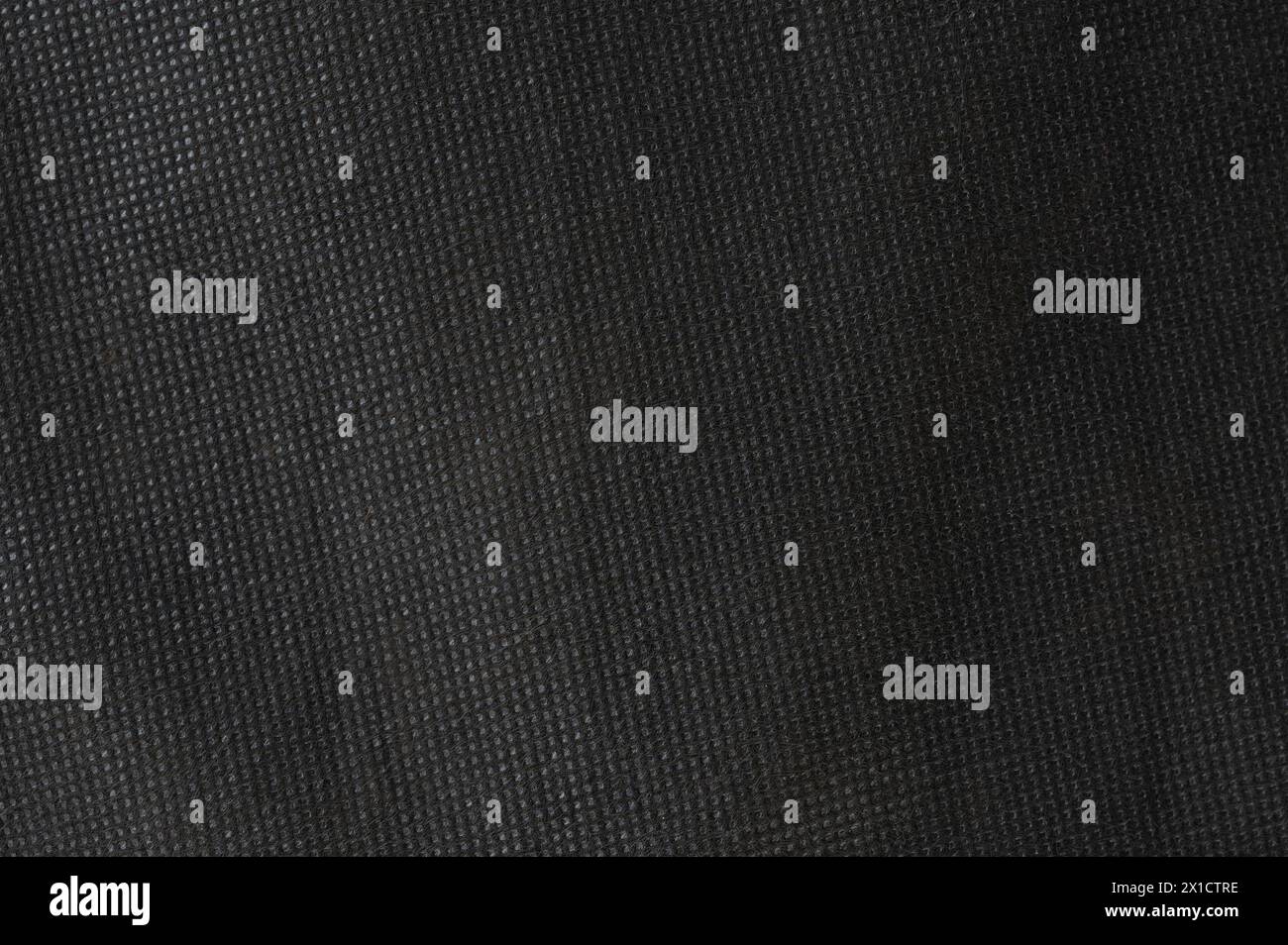 Schwarzer Hintergrund mit Stoffmuster und quadratischer Textiloberfläche Stockfoto
