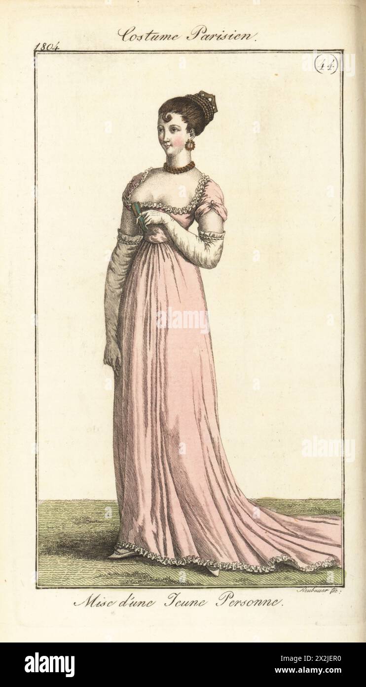 Junge Pariser Frau in Niobe geflochtener Frisur, transparentem, tiefgeschnittenem Musselin-Kleid über rosa Taft-Unterrock. Pl. 587 in der Pariser Ausgabe. Kostüm d'une Jeune Personne. Coeffure en cheveux a la Niobe, Robe de Mousseline claire. Handkolorierter Kupferstich von Friedrich Ludwig Neubauer aus Pierre de la Messengere’s Journal des Dames et des Modes, Francfort sur le mein (Frankfurt) 1804. Nach Illustrationen von Carle Vernet, Jean-Francois Bosio, Dominique Bosio und Philibert Louis Debucourt. Stockfoto