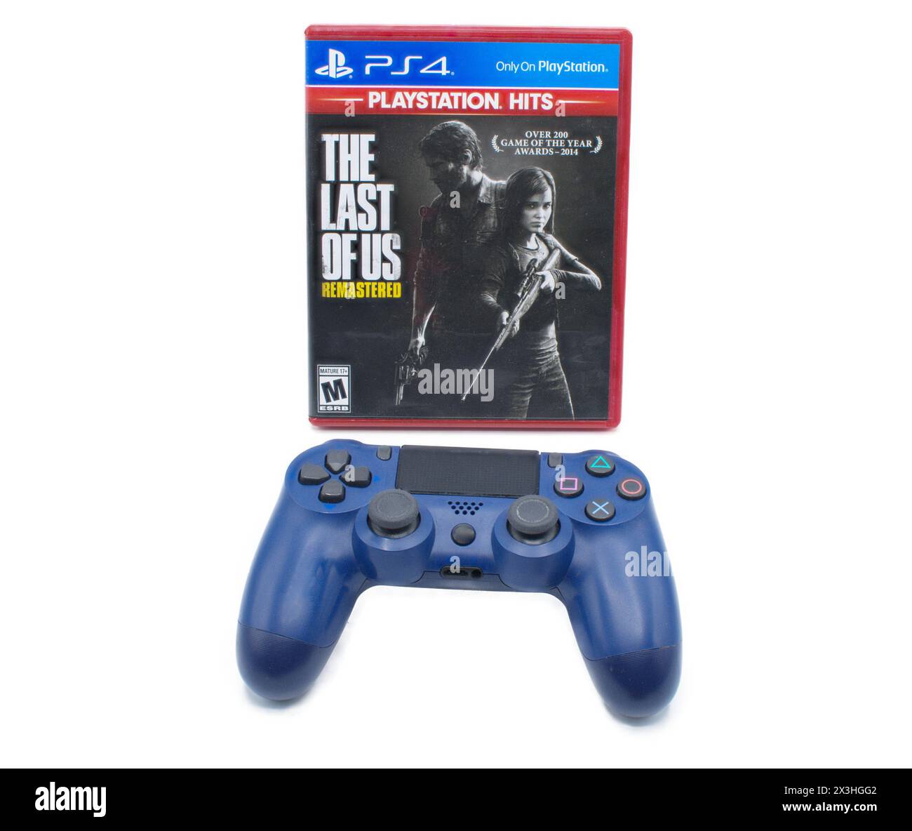 Ocala, FL 2-17-2024 The Last of US Part 1 überarbeitete Videospielbox mit einer Sony Play Station vier 4 Fernbedienung auf weißem Hintergrund Stockfoto