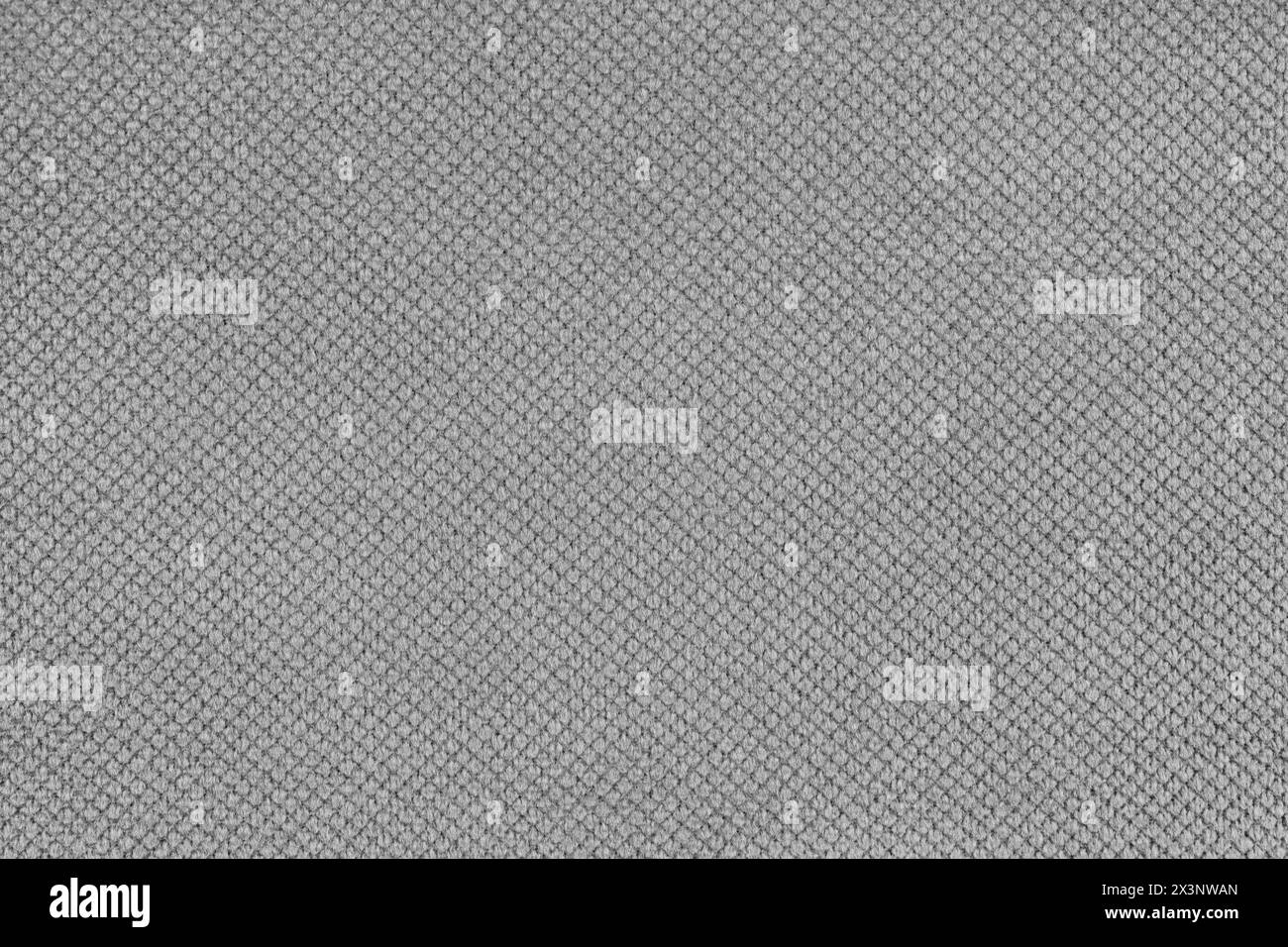 Einfarbiger grauer Velours-Polsterstoff, Jacquard mit feinem Rautenstruktur Hintergrund. Nahaufnahme, Textiloberfläche aus Makrogewebe. Tapete, Hintergrund mit Cop Stockfoto