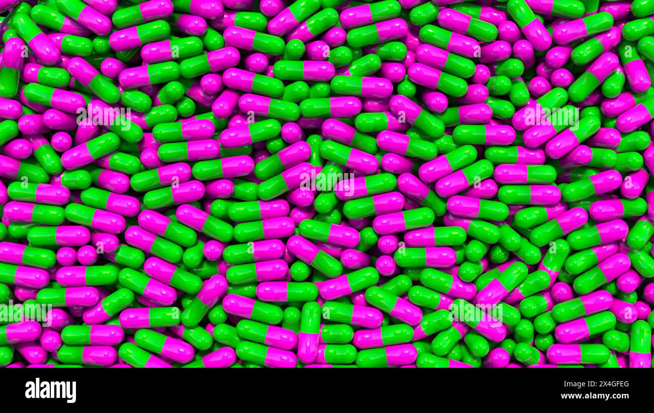 Grüne und rosa medizinische Pillen, Kapseln. Grüne und rosa medizinische Pillen, Kapseln fallen in eine Glasbox, Gesundheit und Medizin. Industrielle Produktion Stockfoto