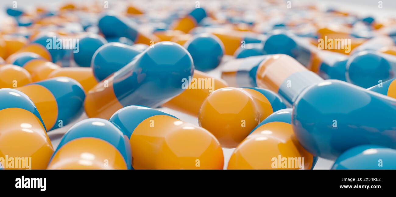 Close-up blau orange medizinische Kapseln, Pillen, Antibiotika. Close-up blau orange medizinische Kapseln, Pillen, Antibiotika. Industrielle Herstellung der Medizin Stockfoto
