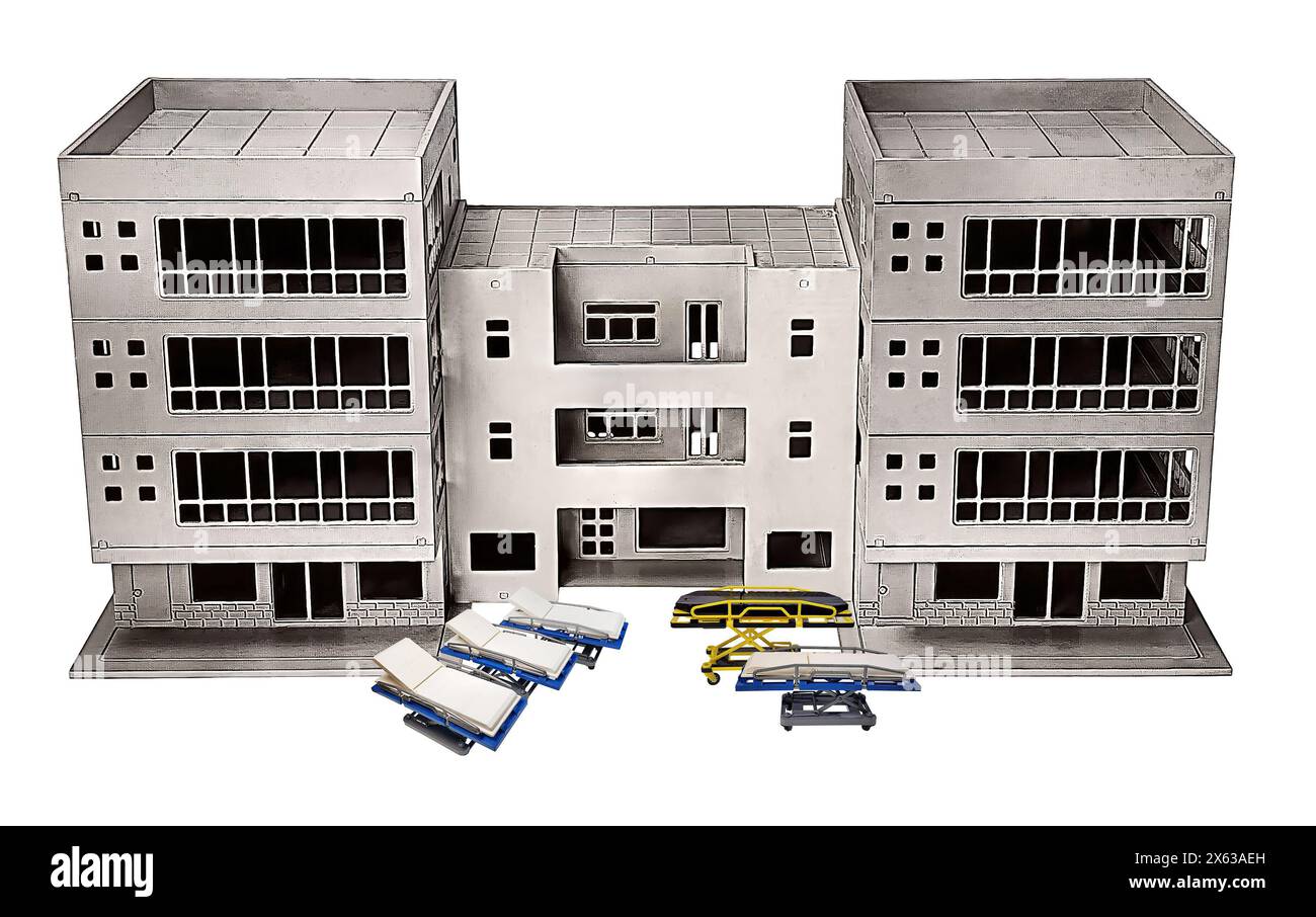 Liege und Krankenhausbett vor einem alten Krankenhausgebäude mit vielen Räumen für Patienten Stockfoto