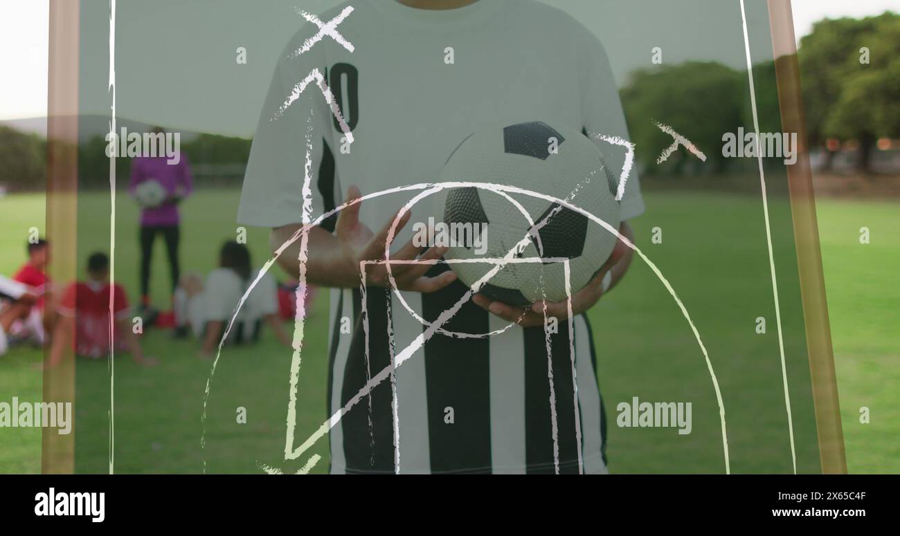 Bild von Spielplänen über verschiedene Fußballspieler im Stadion Stockfoto