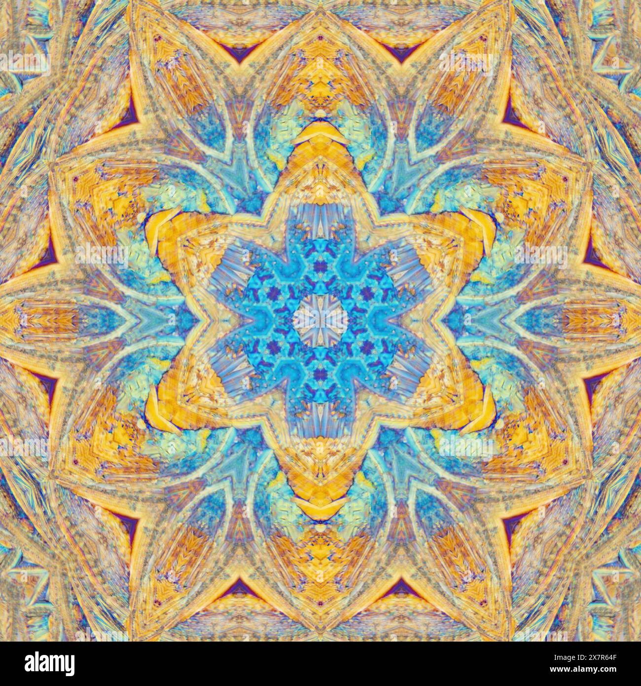 Ein kompliziertes und farbenfrohes Kaleidoskop-Muster mit einem symmetrischen sternförmigen Design mit einer faszinierenden Mischung aus Blau- und Gelbtönen. Stockfoto