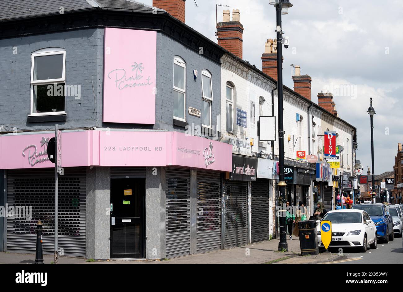 Geschäfte in Ladypool Road, Balsall Heath, Birmingham, Großbritannien Stockfoto