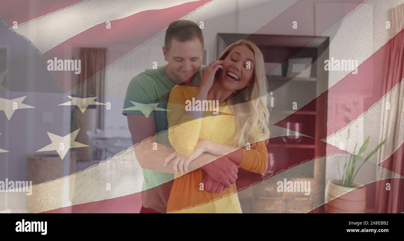 Das kaukasische Paar, junger Berufstätiger und Vater, ist umarmt und lächelt Stockfoto