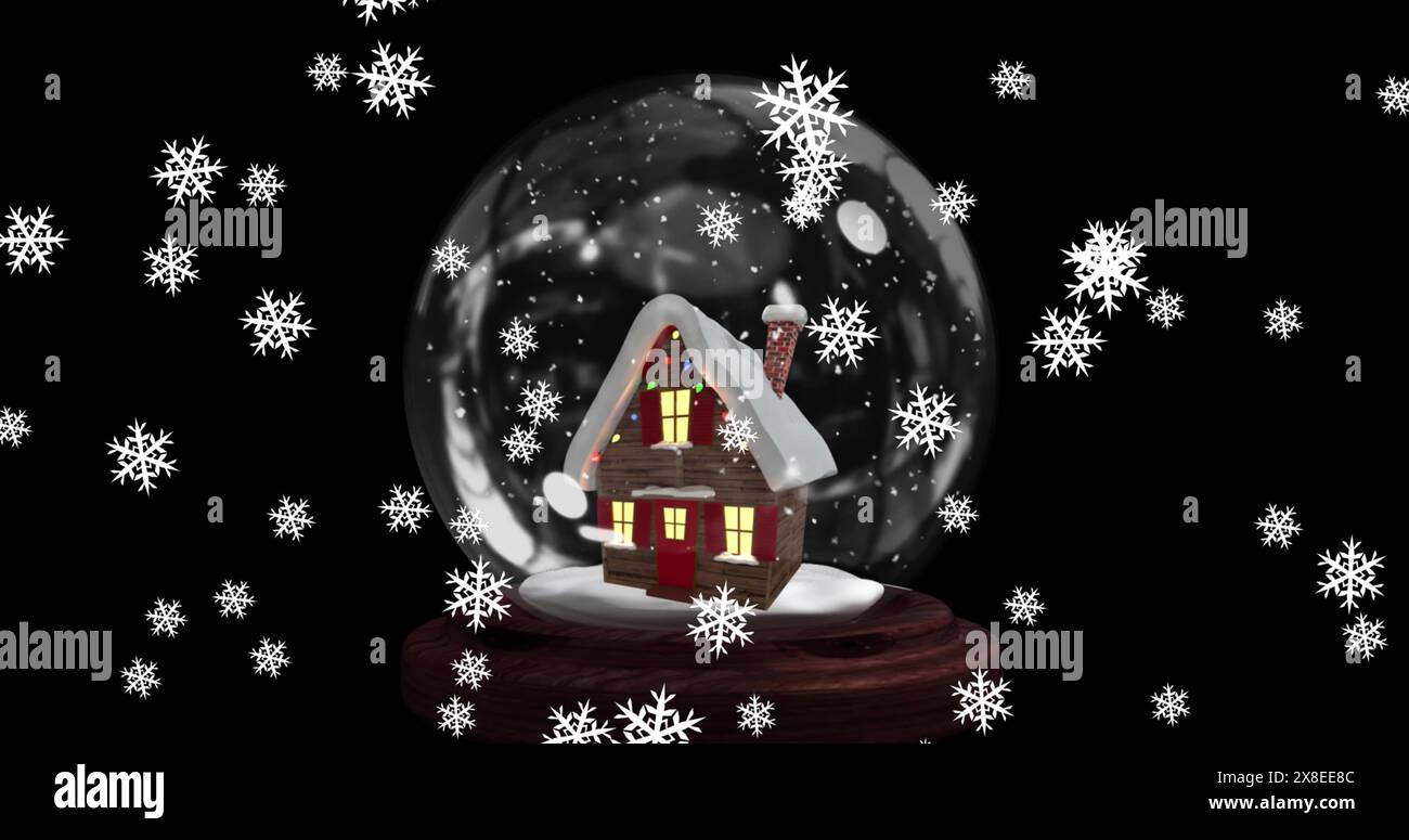 Bild von Schneeflocken, die über das Haus fallen, in einer Schneekugel vor schwarzem Hintergrund Stockfoto