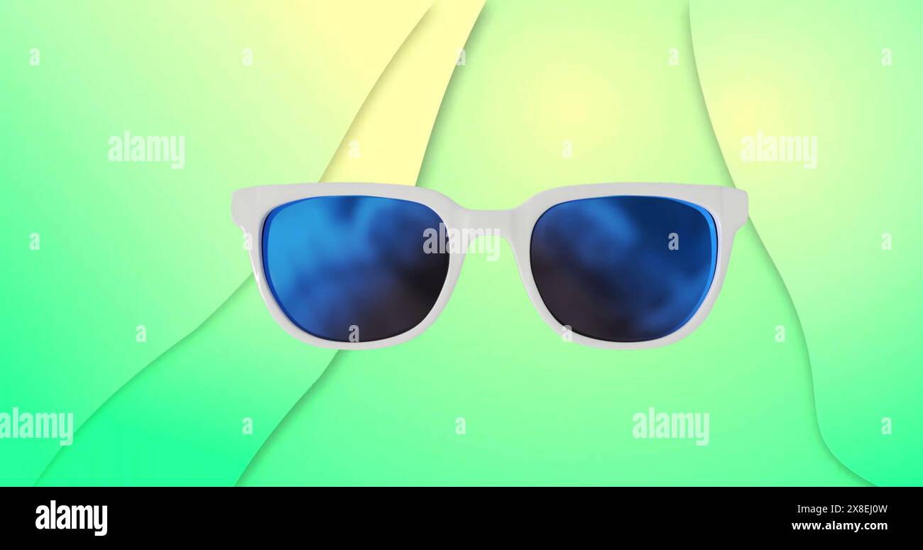 Bild einer bunten Brille auf grünem Hintergrund Stockfoto