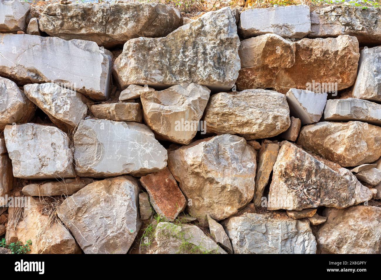 Große Steinwand Hintergrund Textur für architektonische Design und Konstruktion Stockfoto