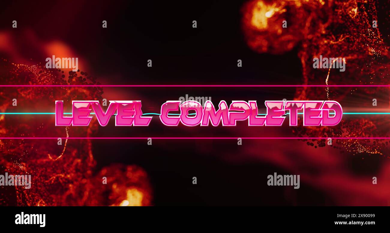 Abbildung des Textes „Level Complete“ über leuchtenden orangefarbenen Flammen Stockfoto