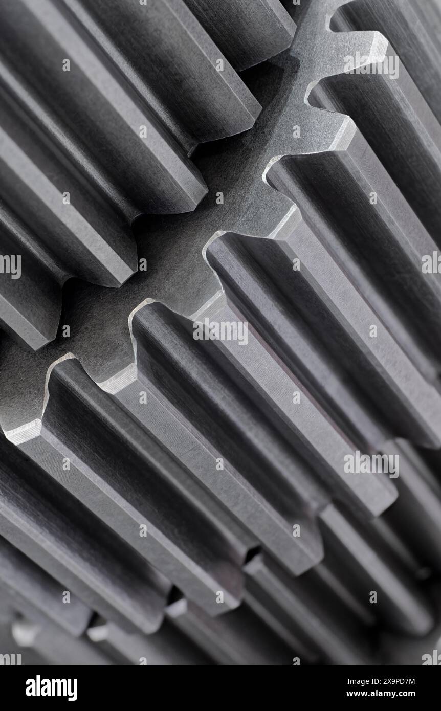 Gruppe von Zahnrädern, Teil des Getriebes oder des Servomechanismus, Nahaufnahme, Maschinenhintergrund Stockfoto