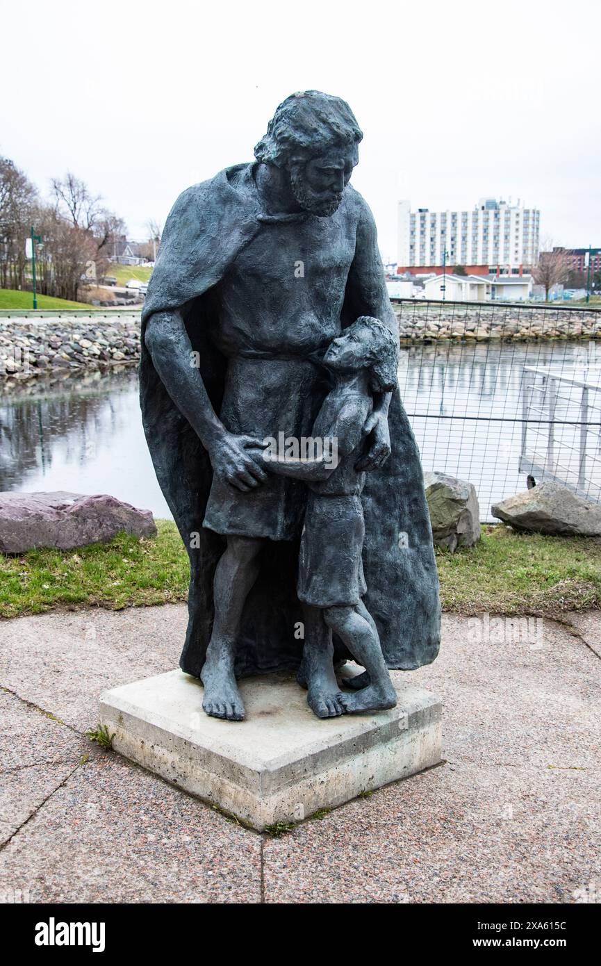 Statue eines Mannes und eines Mädchens am Ufer in Sydney, Nova Scotia, Kanada Stockfoto