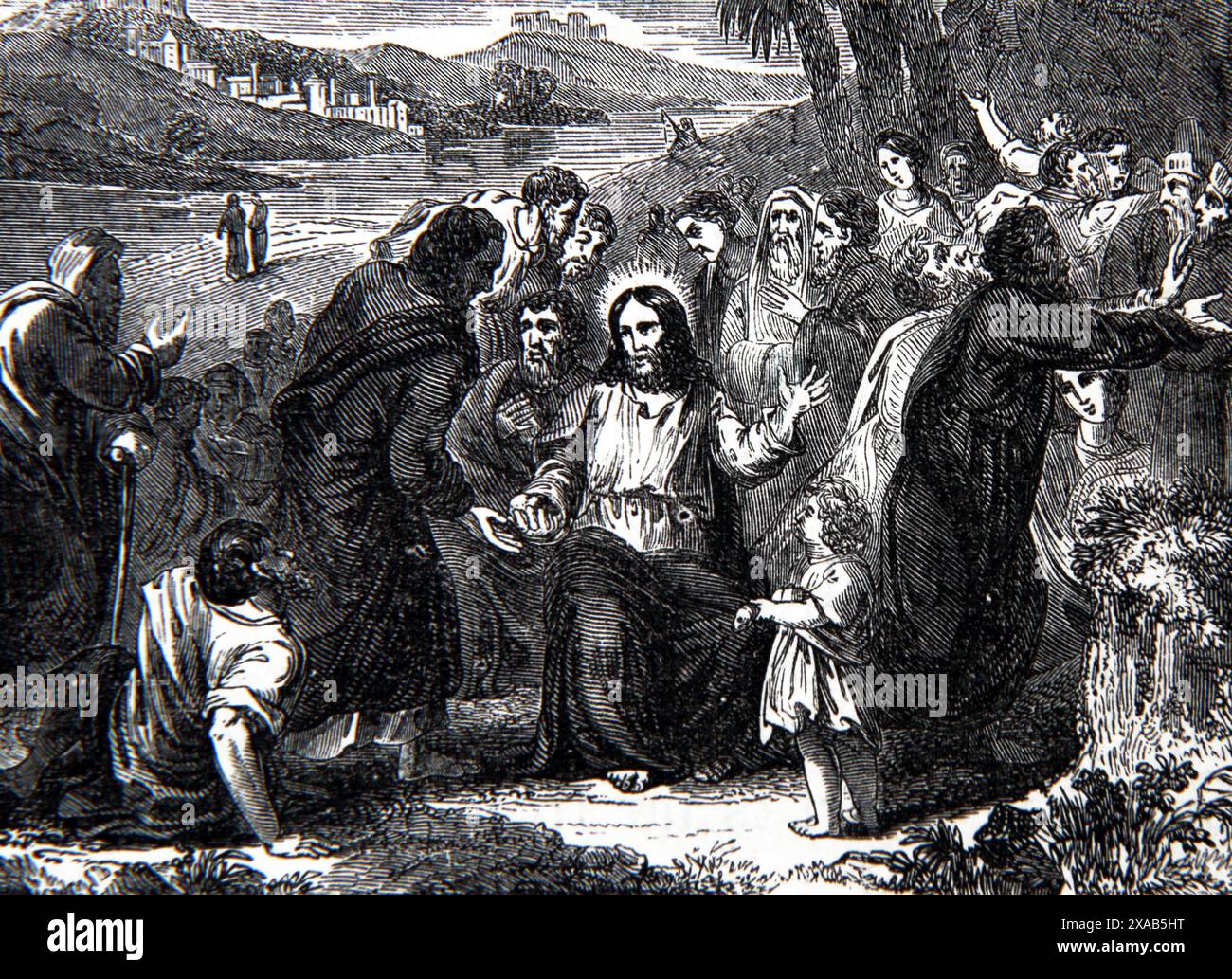 Holzgravur Jesu Christi und das Wunder der Brote aus der antiken Familienbibel des 19. Jahrhunderts Stockfoto