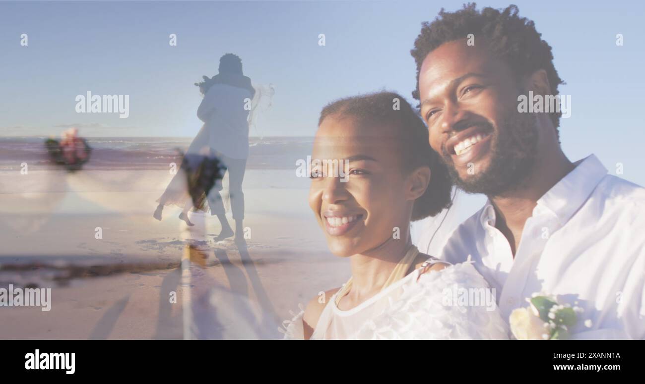 Bild eines glücklichen afroamerikanischen Paares über einem tanzenden Paar am Strand Stockfoto