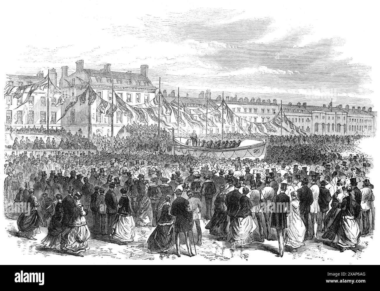 Start eines Rettungsbootes in Weymouth, 1869. "Der Stadt Weymouth wurde vom Earl of Strafford ein Rettungsboot übergeben, das am Dienstag in Anwesenheit einer großen Versammlung von Zuschauern gestartet wurde. Sie wurde zuerst in einer Prozession durch die Straßen getragen. Der Bürgermeister und die Gesellschaft der Stadt, zusammen mit vielen der benachbarten Adeligen, schlossen sich der Prozession an, die aus den Offizieren und Seeleuten der Coastguard-Stationen in der Nähe von Weymouth, 300 Jungen vom Marineschulschiff Boscawen und der Band der Royal Engineers bestand. Die Szene war eine der animiertesten aller Zeiten Stockfoto