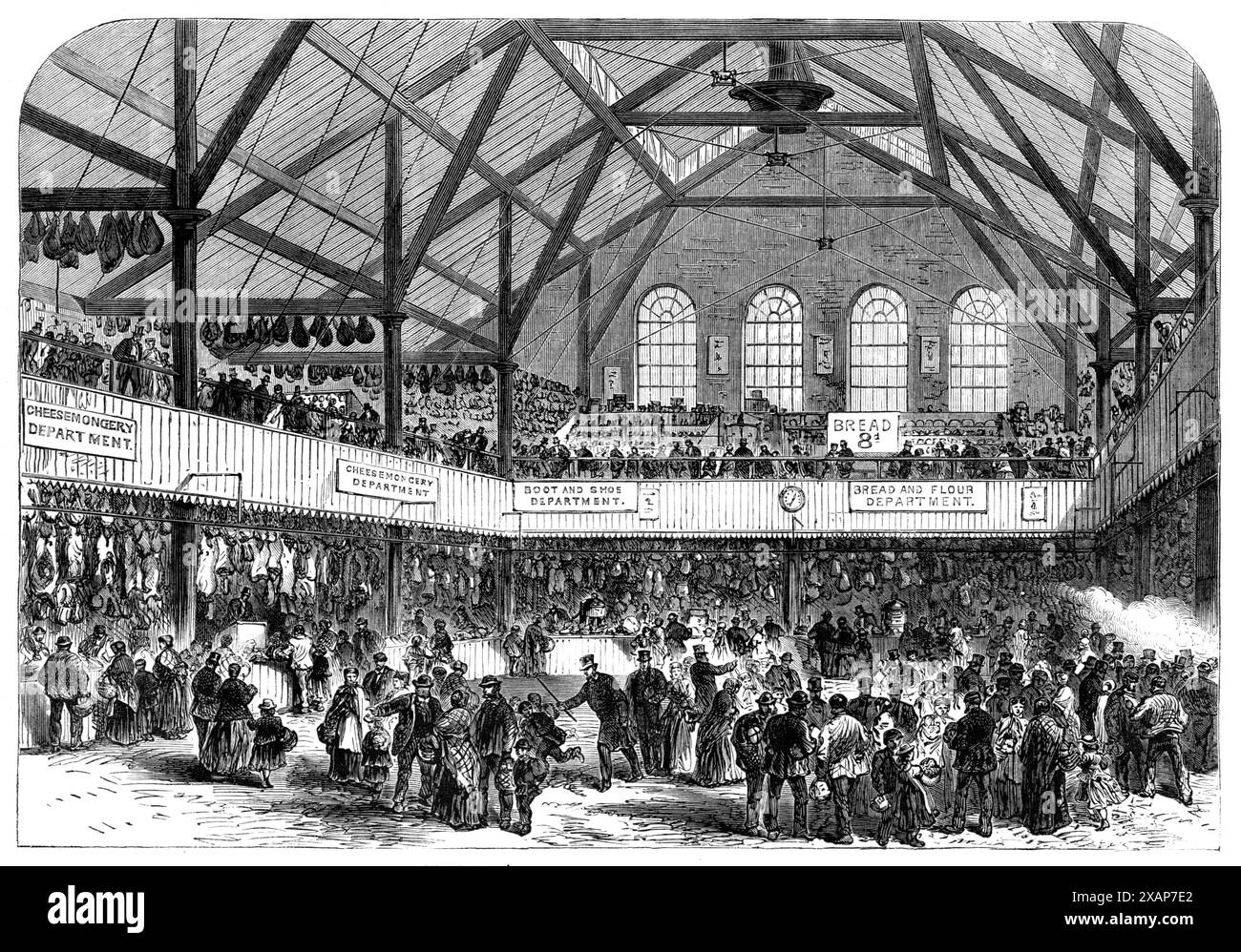 Der Volksmarkt, Whitechapel, [East London] 1868. "...die Einrichtung, 272, Whitechapel-Road, wurde eröffnet... für den Einzelhandel zu gemäßigten Preisen von gutem Fleisch, Gemüse und anderen notwendigen Gütern an die Arbeiterbevölkerung dieses Bezirks ... der Markt wird nachts von zwei großen Sonnenlichtern beleuchtet, die gleichzeitig der Beleuchtung und Belüftung dienen; und auf jeder Seite des Gebäudes befindet sich eine Reihe von louvre-Fenstern, die bei warmem Wetter geöffnet werden können... die Stände oder Geschäfte verlaufen um das Gebäude herum, eine Reihe im Erdgeschoss und die andere in einer Galerie darüber; die AR Stockfoto