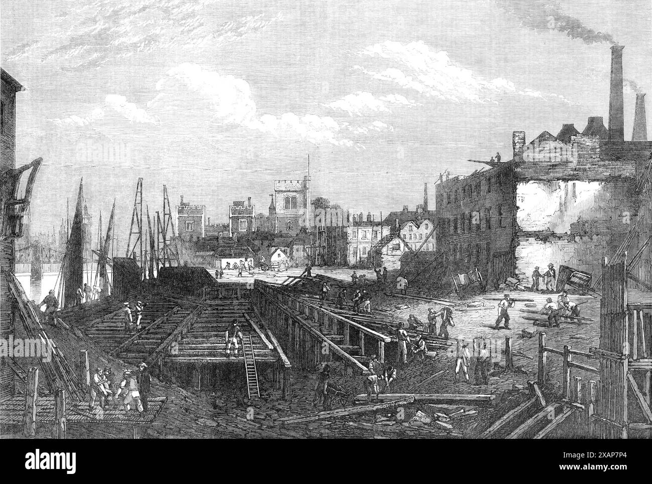 Werke des südlichen Botschafters der Themse in Lambeth, [South London], 1868. Ein Blick auf den gegenwärtigen Aspekt der Arbeiten für den südlichen Damm der Themse, etwas oberhalb des Lambeth Palace. Die Flussmauer wird, wie auf der Middlesex-Seite, mit Hilfe einer durchgehenden Reihe von eisernen Caissons errichtet, die im Wasser versenkt sind und eine temporäre Mauer bilden, hinter der das Mauerwerk aus massivem Granit gelegt ist. In der Zwischenzeit ist der Hohlraum zwischen der Mauer und dem alten Ufer mit Erde oder Müll gefüllt, was viele Karren und Karren dazu bringen. Ein Gerüst von Ma Stockfoto