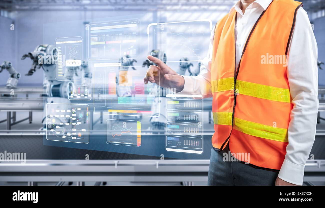 Techniker oder Ingenieure arbeiten mit Roboterarmen im Werk Stockfoto