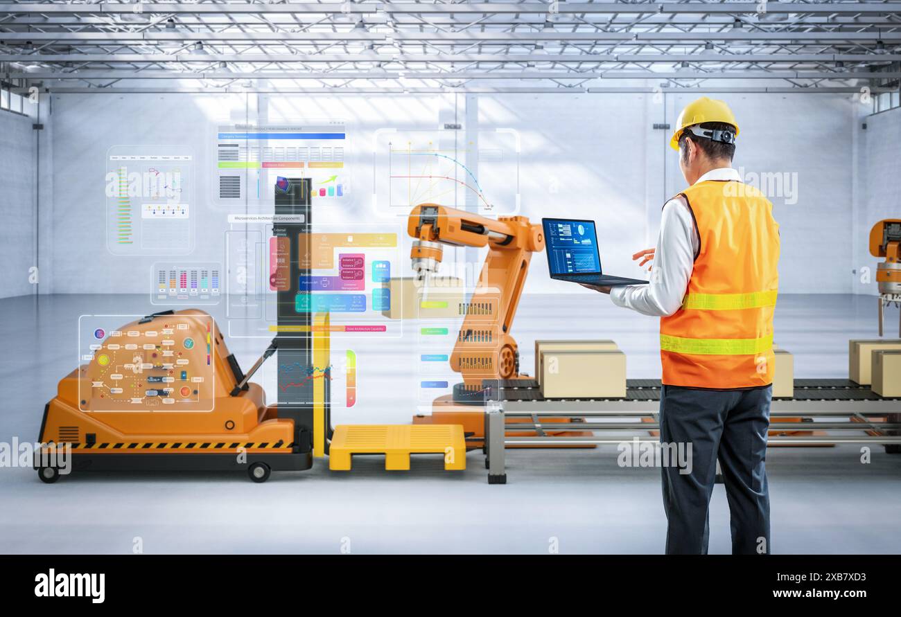Techniker oder Ingenieure arbeiten mit Roboterarmen im Werk Stockfoto