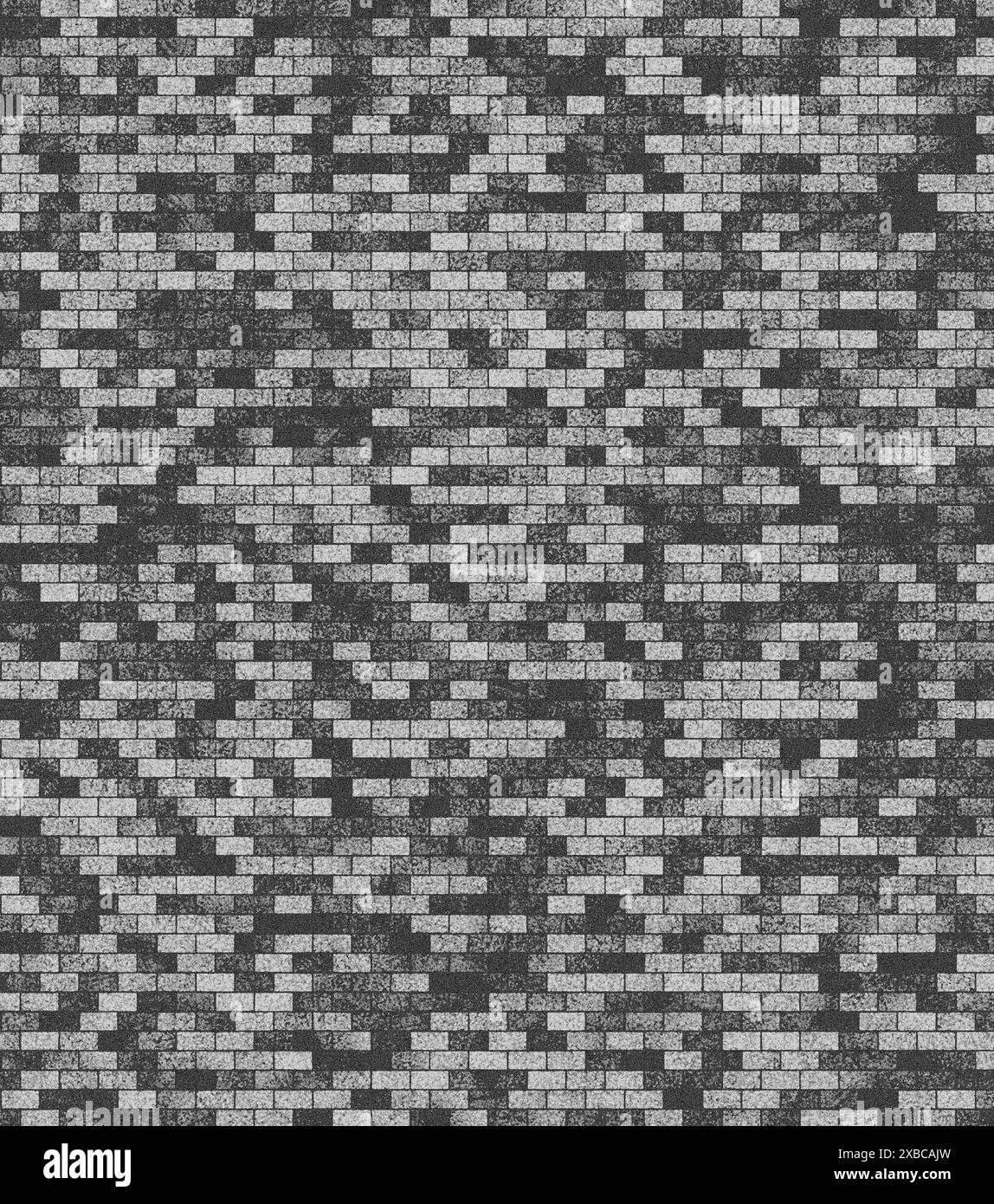 Graue Ziegelwand mit einem komplizierten Muster, das durch unterschiedliche Schattierungen von Ziegeln erzeugt wird, Hintergrundbild Stockfoto