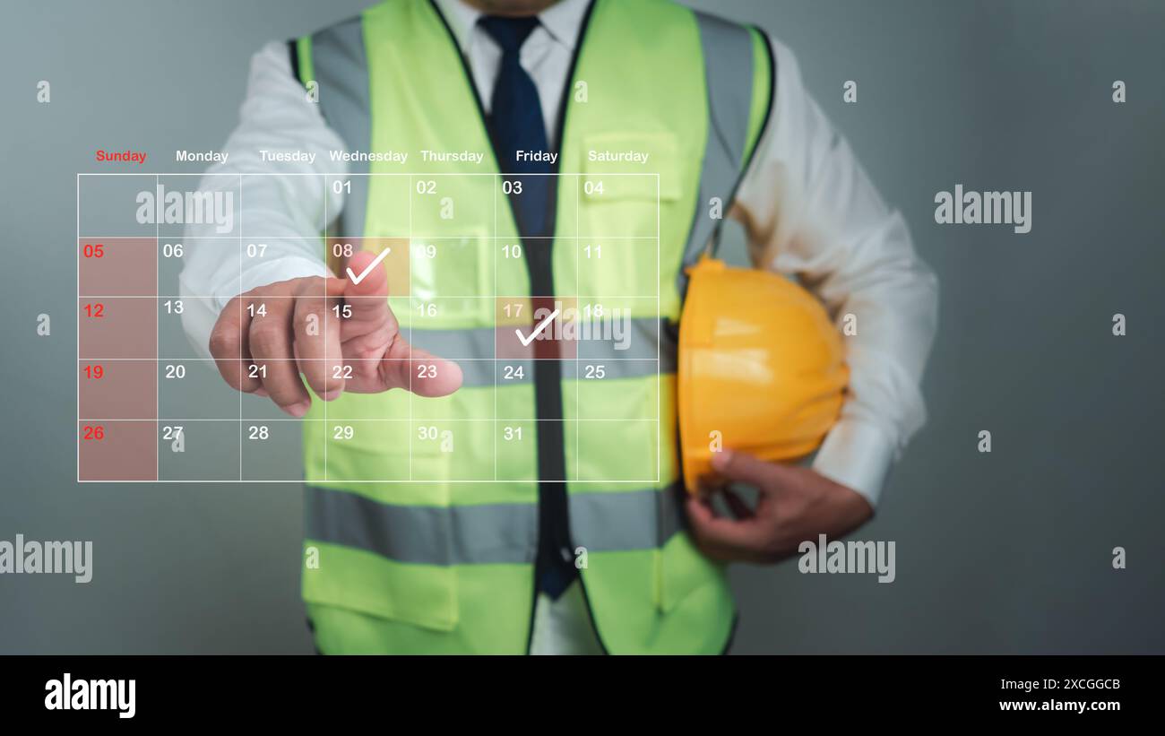 Architekt oder Ingenieur, der mit dem Finger auf Baudaten im virtuellen Kalender, Projektpräsentationsplan, Baukostenplanung, Konstrukt zeigt Stockfoto