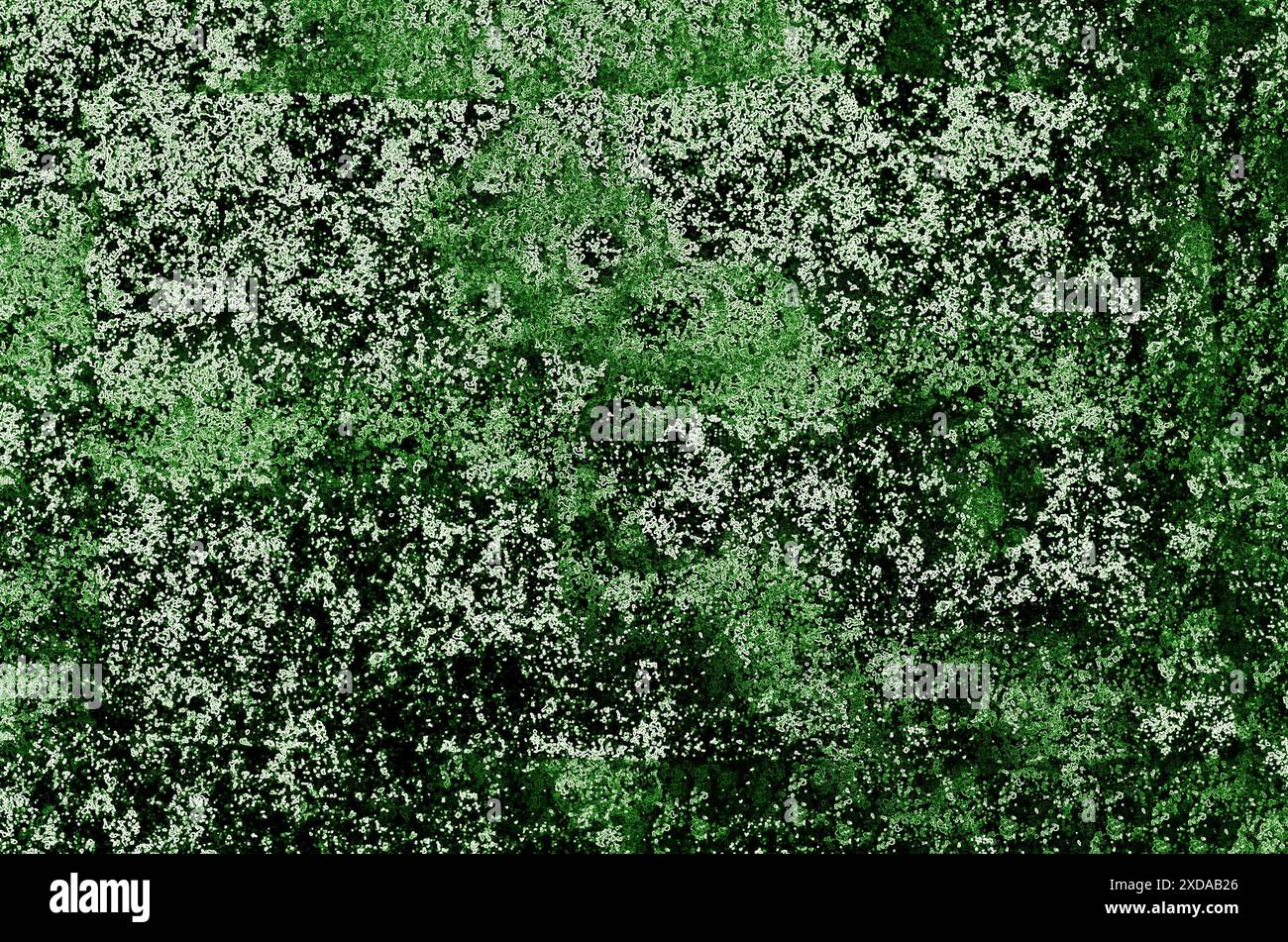 Abstrakte, grün gesprenkelte Textur, die ein mosaikartiges Muster bildet und ein Gefühl organischer, komplizierter Kunst schafft Stockfoto