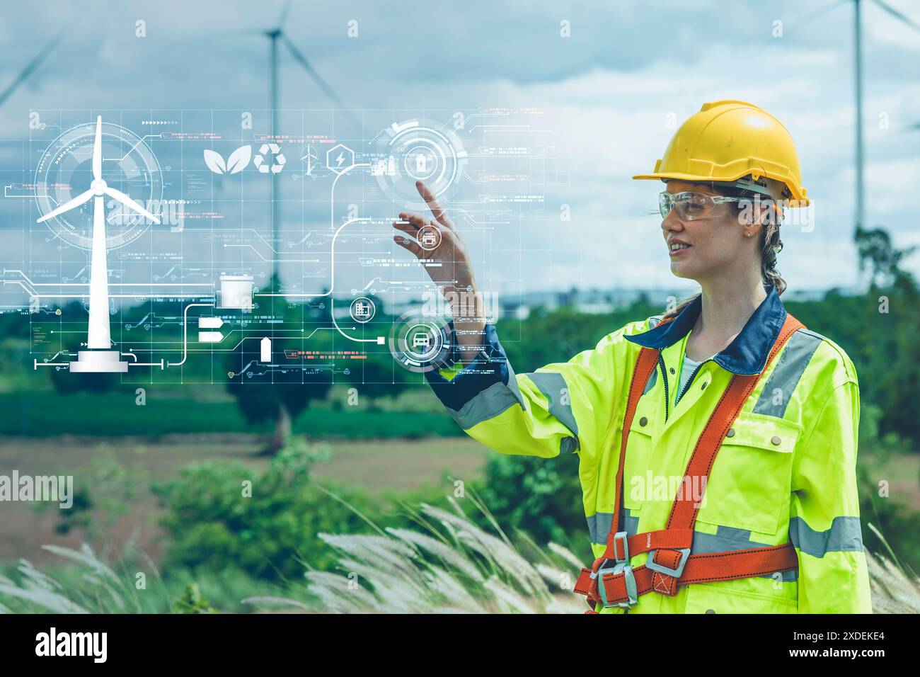 Konzept für saubere Energie, Ingenieurinnen Happy Smile in Windturbinenfarm im Freien Hand Touch-Overlay Power Control Panel Grafik. Stockfoto