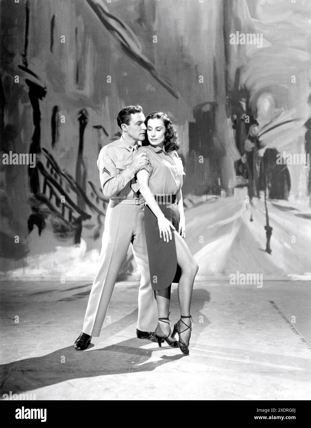 GENE KELLY und TAMARA TOUMANOVA in Ring Around the Rosy Segment als EINLADUNG ZUM TANZ 1956 Regisseur/Choreograf GENE KELLY Kostümdesigner Rolf Gerard Produzent Arthur Freed Metro Goldwyn Mayer (MGM) Stockfoto