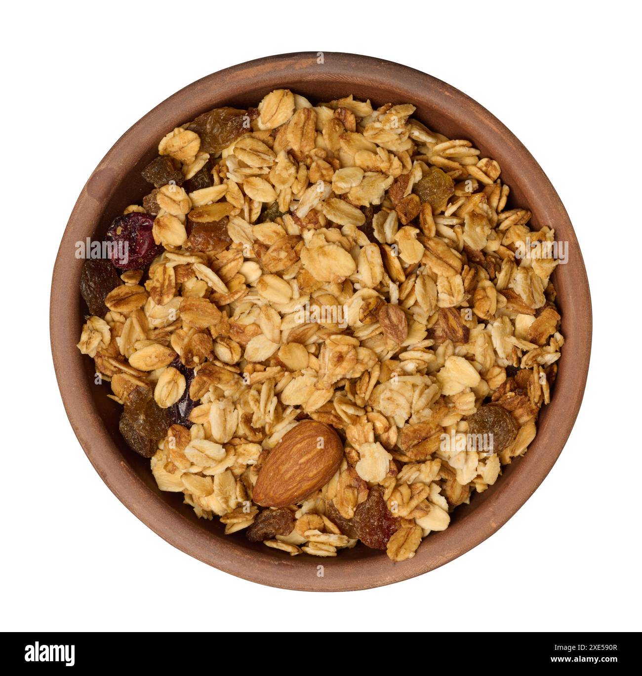 Haferflocken, Rosinen, Cashews und Mandeln. Müsli in runder Platte Stockfoto