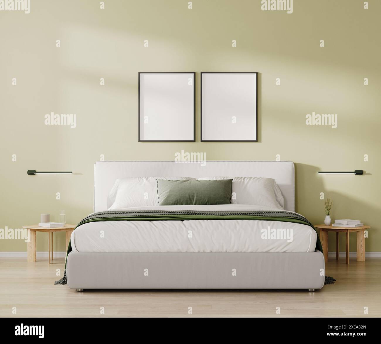 Zwei leere Rahmen über dem Bett im Schlafzimmer in hellgrünem Ton, 3D-Rendering Stockfoto
